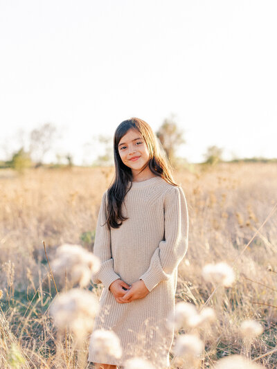 girl standing in a field smiling Cynthia Knapp Photography Fort Worth photographer