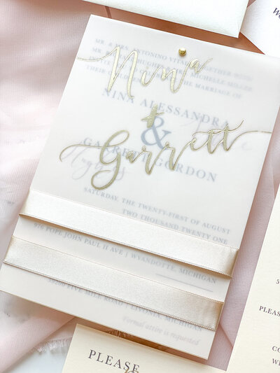 vellum and foil wedding invitation with ribbon bellyband