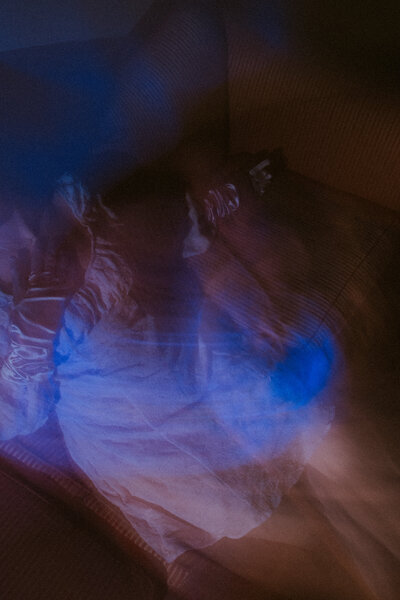 A bride and her groom underneath her veil.