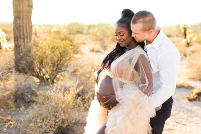 Scottsdale maternity couple holding baby bump
