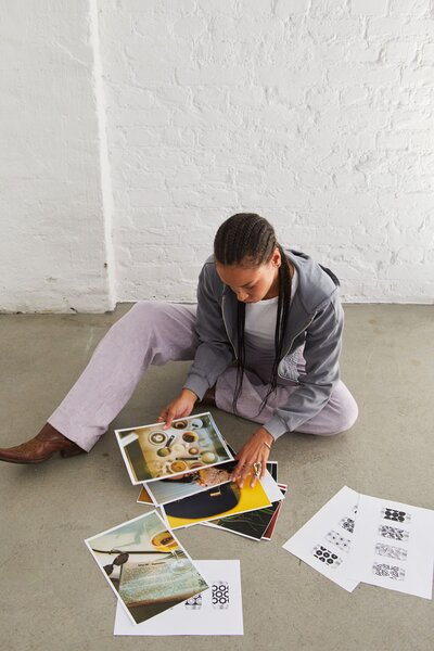 Hand's holding colorful flowers