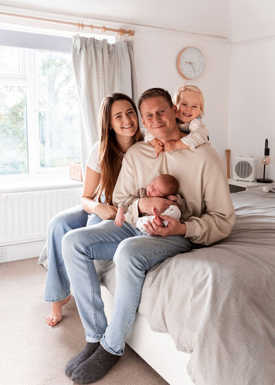 family cuddle together in photo