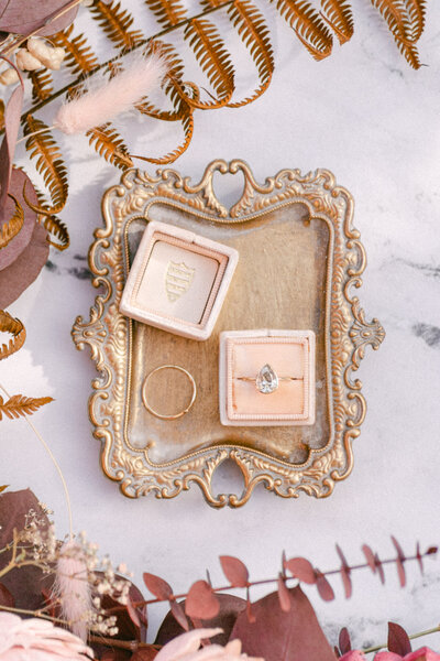 staged flatlay photo of a diamond ring and box