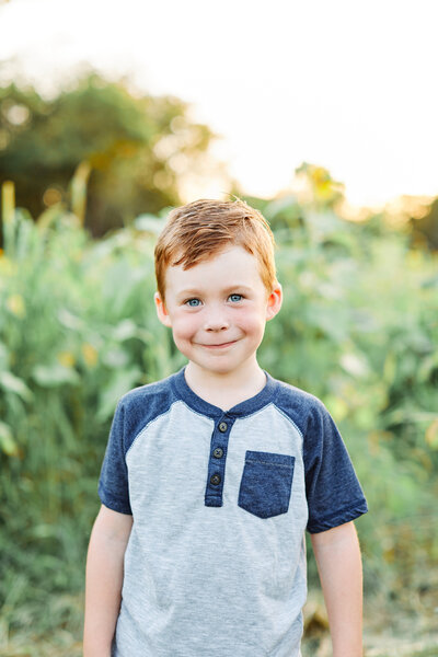 Young Boy in field of sunflowers