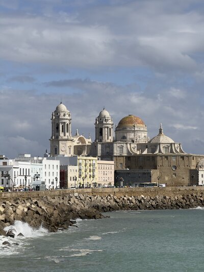 Scenic Cadiz waterfront view with historic buildings and ocean vista