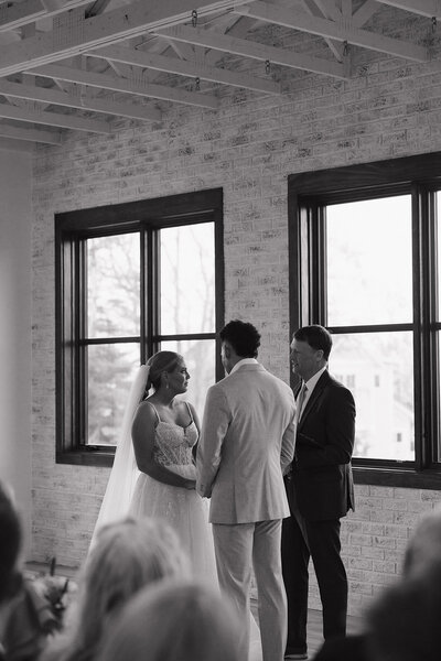 bride sitting at head table