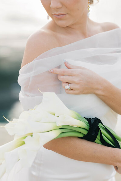 Charleston Wedding Photographer | Photo of bride touching her veil and holding bouquet