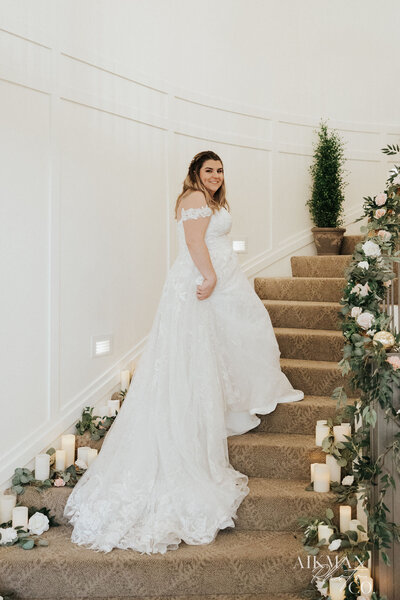 Bride standing on staircase