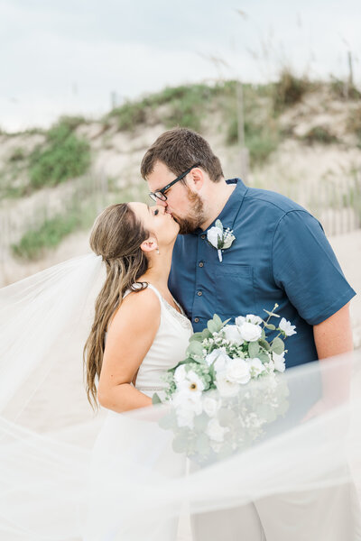 Corolla Beach North Carolina Wedding on the beach Newlyweds Kiss