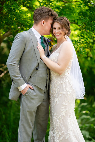 A couple warmly embraces during a wedding portrait in Shenandoah National Park, captured by Nathan Sottung Photography, a Virginia wedding photographer
