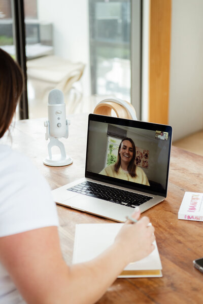 Chantal Hewitt wearing a white shirt and jeans coaching a mother of an autistic child virtually on her laptop - Family Autism Support Coach at Chantal Hewitt Coaching 7