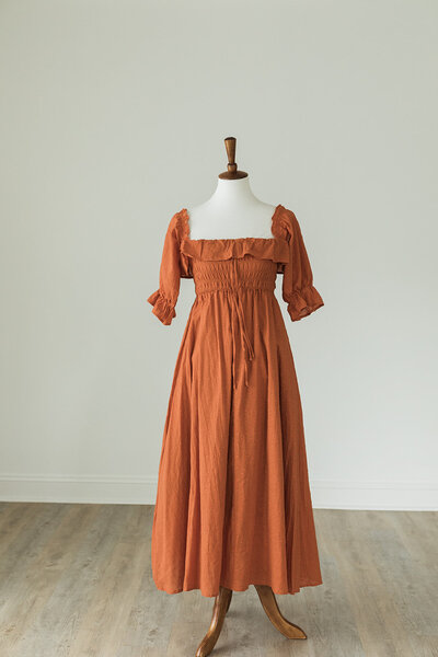 free people style dress in burnt orange with ¾ length sleeves