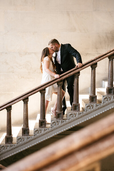 Couple kissing on staircase during Nashville courthouse elopement