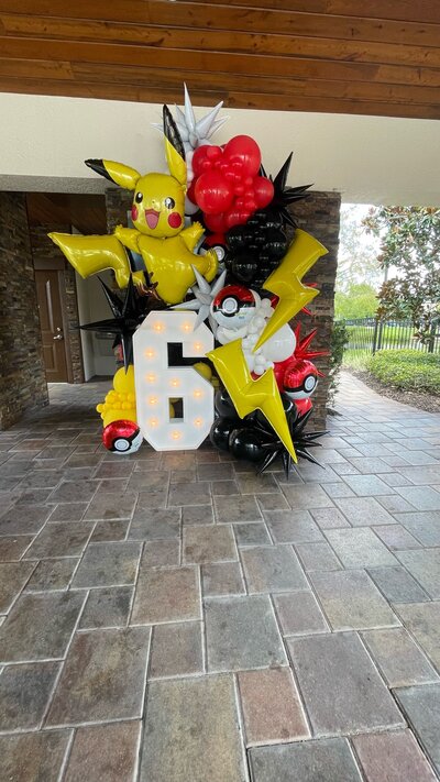 Custom Pokemon balloon decorations for a child's 6th birthday party by Loononna, LLC in Central Florida.