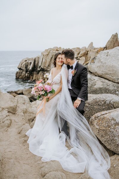 bride and groom embracing  at Pebble Beach Resort wedding
