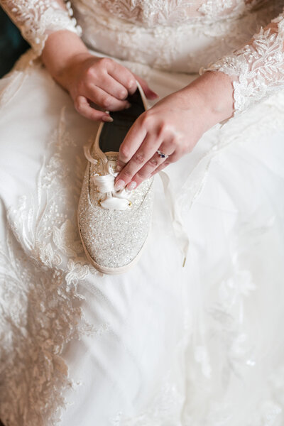 Bride put on non-traditional wedding shoes on