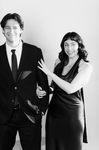 Black and white portrait of a stylish couple posing together at a Vogue Portrait photo booth in Richmond, VA.