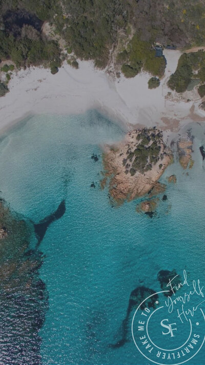 The stunning coastline of Sardinia, Italy, featuring turquoise waters, rugged cliffs, and pristine beaches, offering a perfect Mediterranean escape.