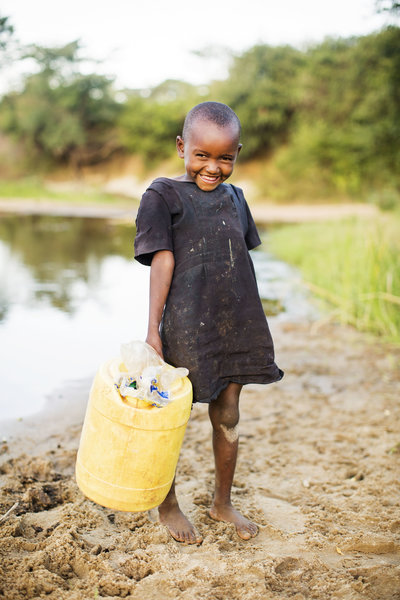 Girl in Kenya getting water