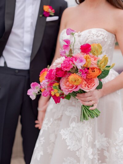 bride holds a bouquet of fresh flowers
