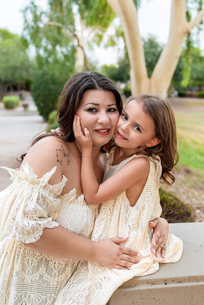 Arizona mom holding her belly for her rainbow baby maternity session in Arizona with photographer Cactus & Pine Photography LLC