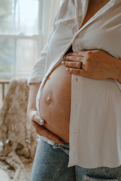 Mother-to-be holding her pregnant belly 