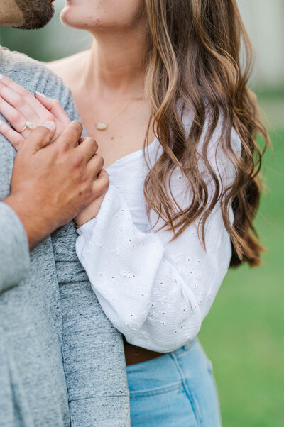 Engaged couple hugs during their engagement session at Anchorage Trail in Louisville, Ky