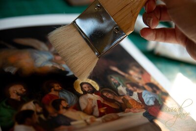 woman holding paintbrushes