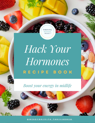 Cover of “Hack Your Hormones Recipe Book” by The Thriving Woman Project. Colourful smoothie bowl surrounded by berries and fruit, with the subtitle “Boost your energy in midlife.”