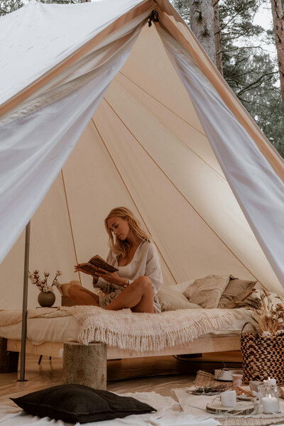 Woman journaling in a yurt