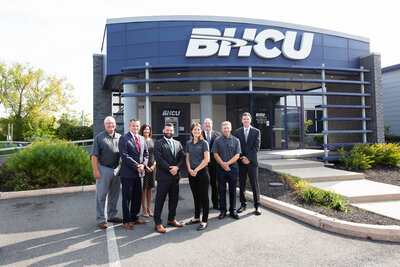 Group of bankers standing in front of a credit union
