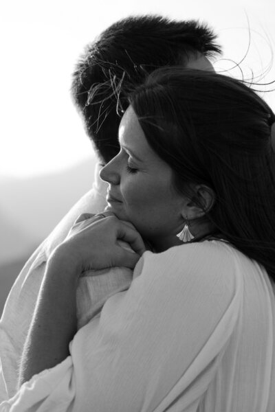 bride holding groom close during italy elopement