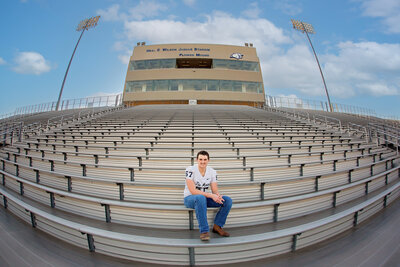 A Oklahoma high school senior is photographed in an urban street.