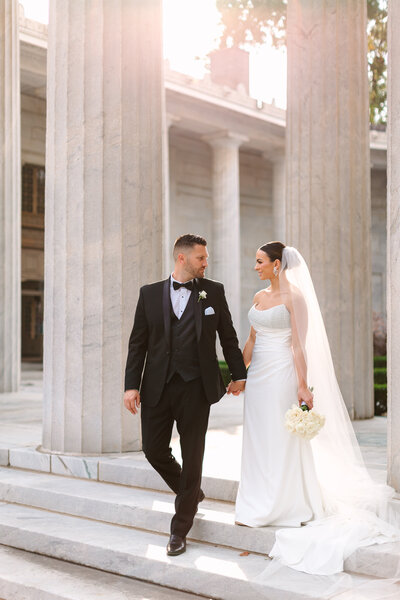 bride smiling and holding bouquet