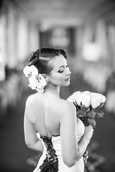 Beautiful photo of a bride showing off the back of her dress.
