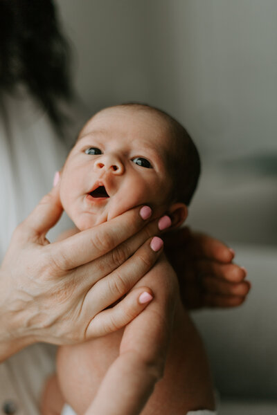 Family Photographer, Mother kissing the cheek of her child