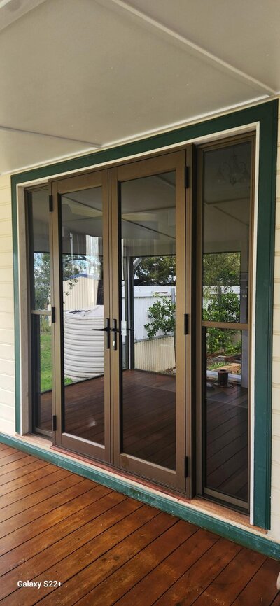 Stylish custom aluminium doors with durable glass panels, perfect for enhancing home functionality and security.