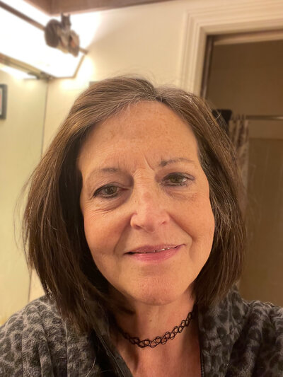 Dr. Lisa Hassinger, a compassionate veterinarian with over 35 years of experience, dedicated to providing dignified and loving care for pets and their families in Lansing, Michigan, through Nature's Way Pet Aquamation