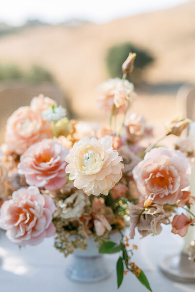 Beautiful peach and orange wedding floral arrangement