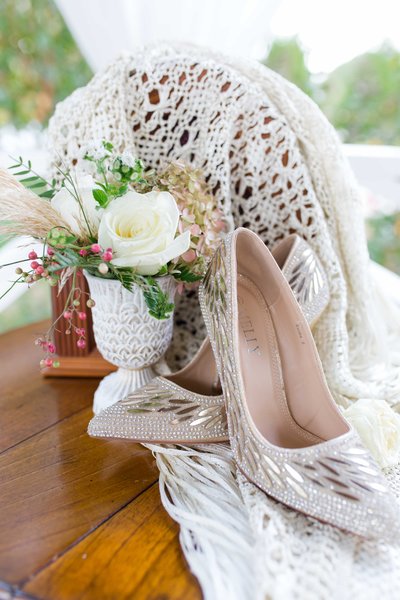 Great gatsby themed wedding details with bouquet and bridal shoes