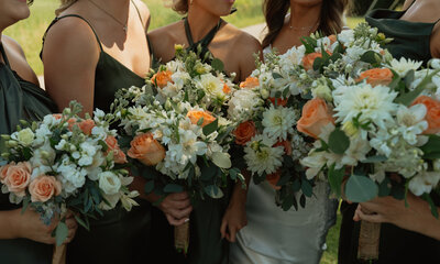 bride and bridesmaids holding their bouquets