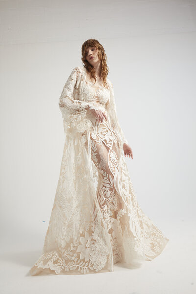 black and white image bride wearing  long sleeve lace wedding dress