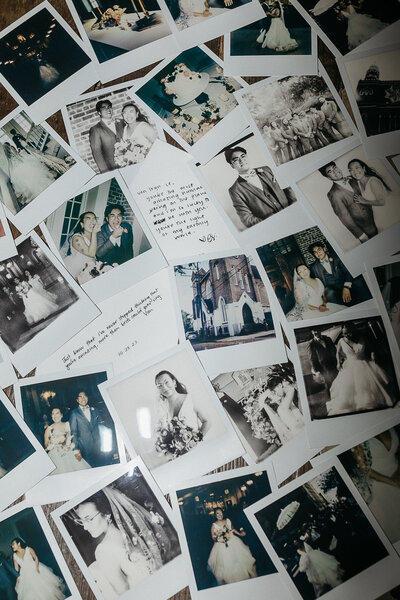 A scattered collection of Polaroid wedding photos showing various moments of a wedding, including the couple, guests, and handwritten notes.