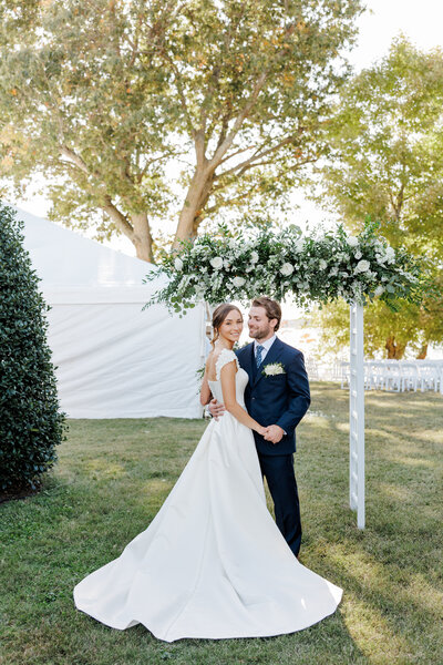 groom holding bride on wedding day