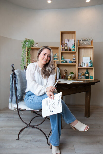Merlyn Asencio in a professional setting, exuding confidence and expertise as a trauma therapist committed to helping clients heal in Miami, Florida