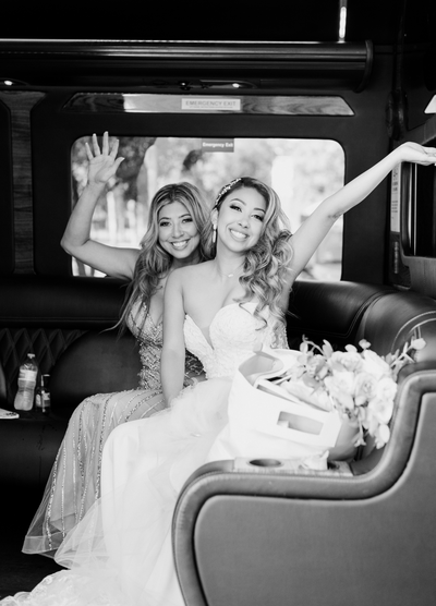 San Antonio wedding; a bride with her mother celebrating in a limo