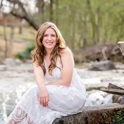 wedding photographer in Texas portrait of artist sitting near the river in New Braunfels