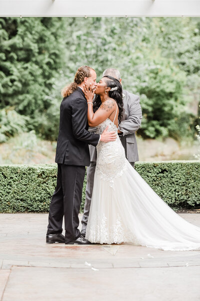 bride and groom kissing after saying their I do's at  Rock Creek Gardens in Puyallup, Washington. Beautiful  and elegant wedding venun in Puyallup, Washington to get married.