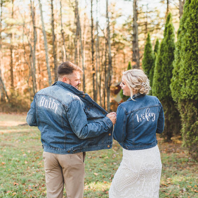nc photographer captures bride and groom in custom jean jackets on wedding day
