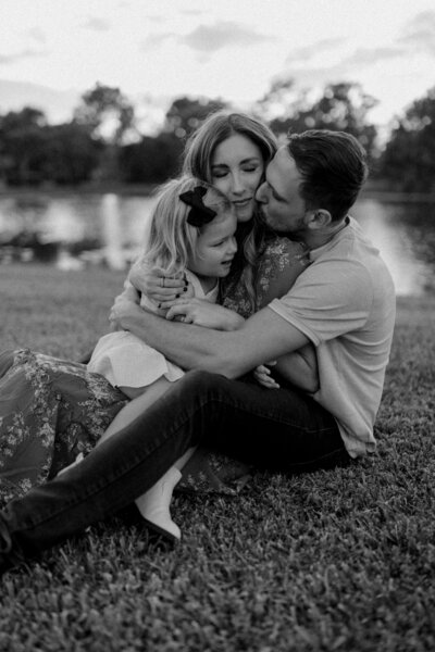 Parents Hugging Daughter Tampa Park